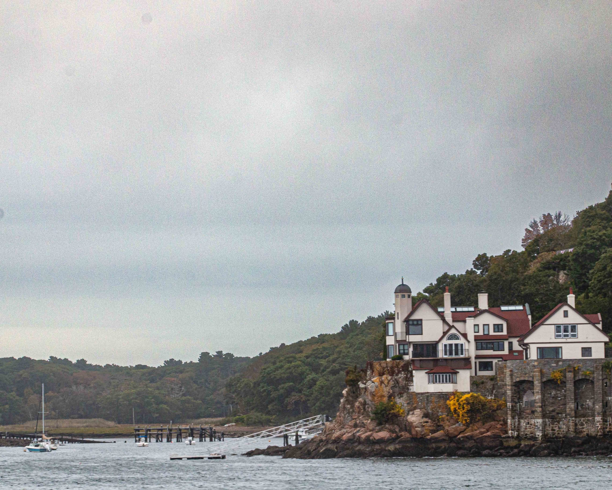 Charming harborside home in Gloucester, Massachusetts, overlooking the water on a cloudy day